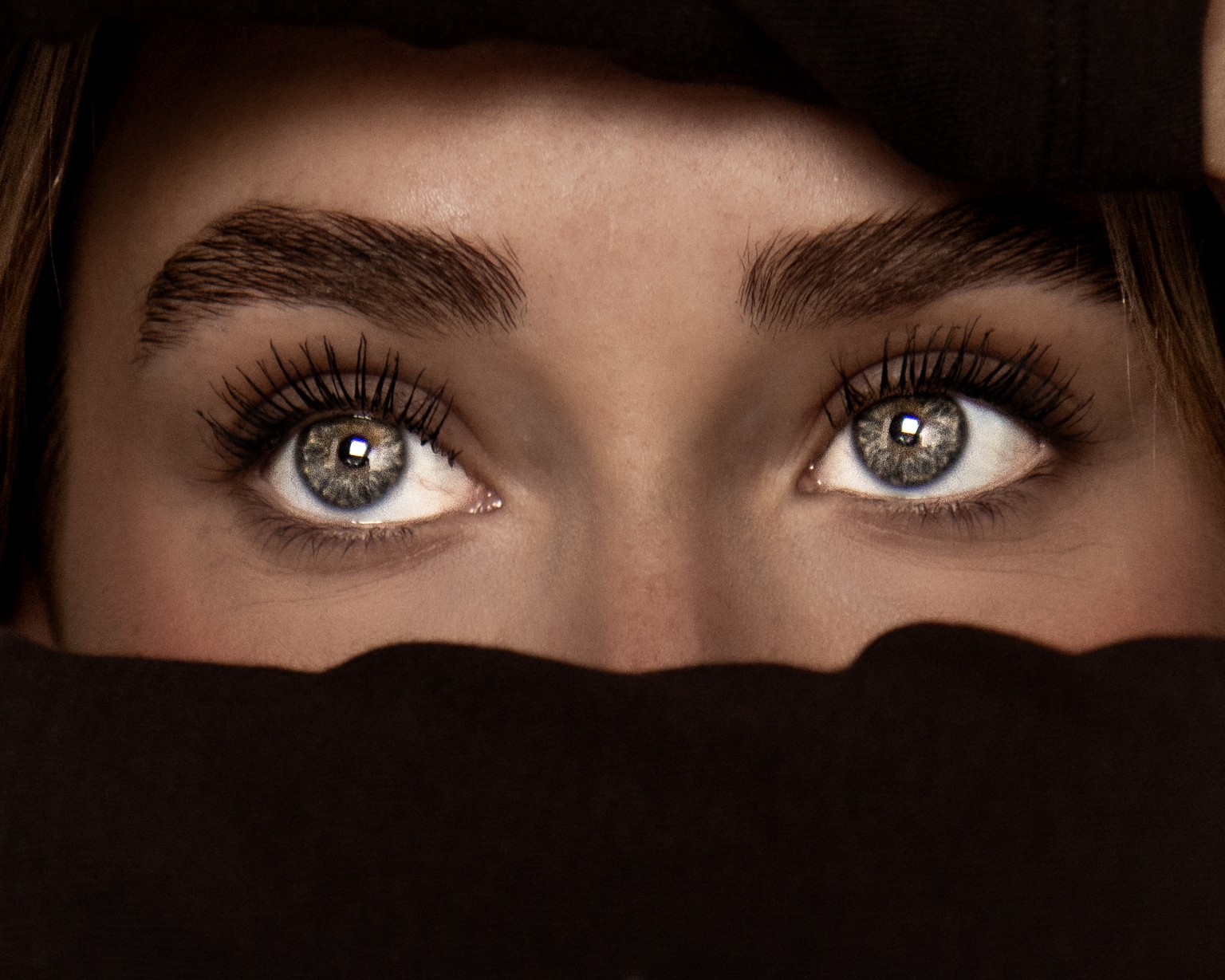 Close-up van ogen in een donker fine art portret